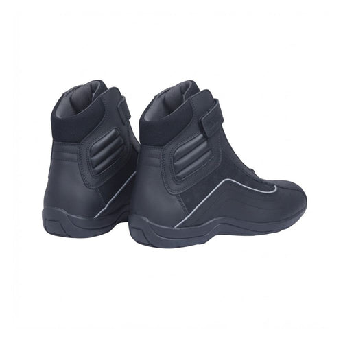 A pair of black high-top protective boots, shown from the rear three-quarter view against a plain white background.
