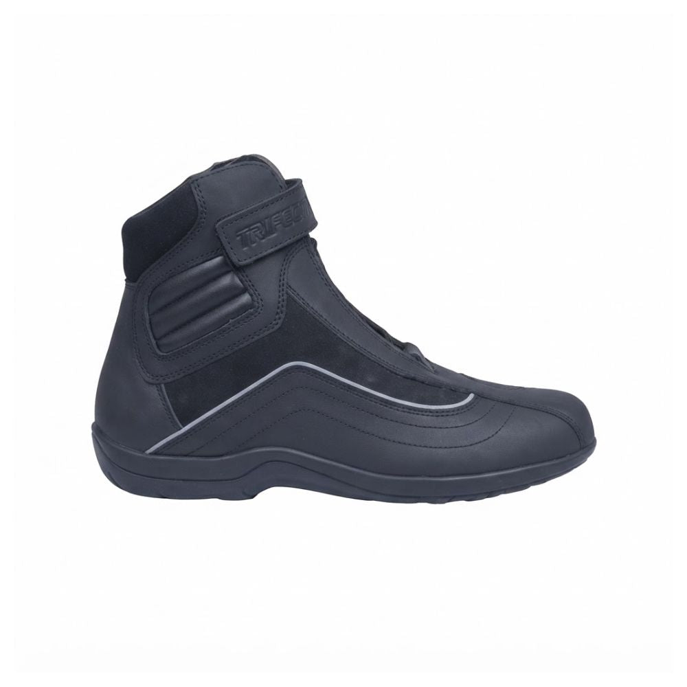 A black high-top protective boot with a hook-and-loop strap on the ankle, shown from a side profile against a white background.
